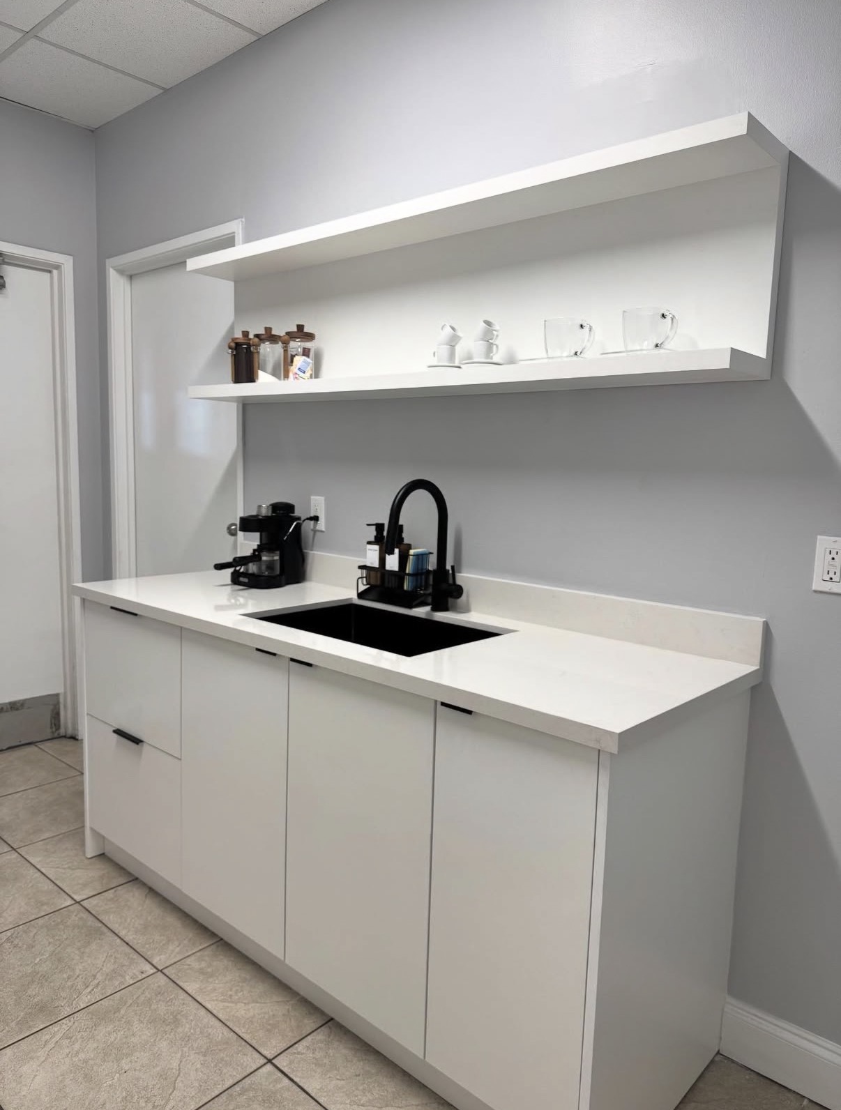 Modern white office kitchenette after renovation